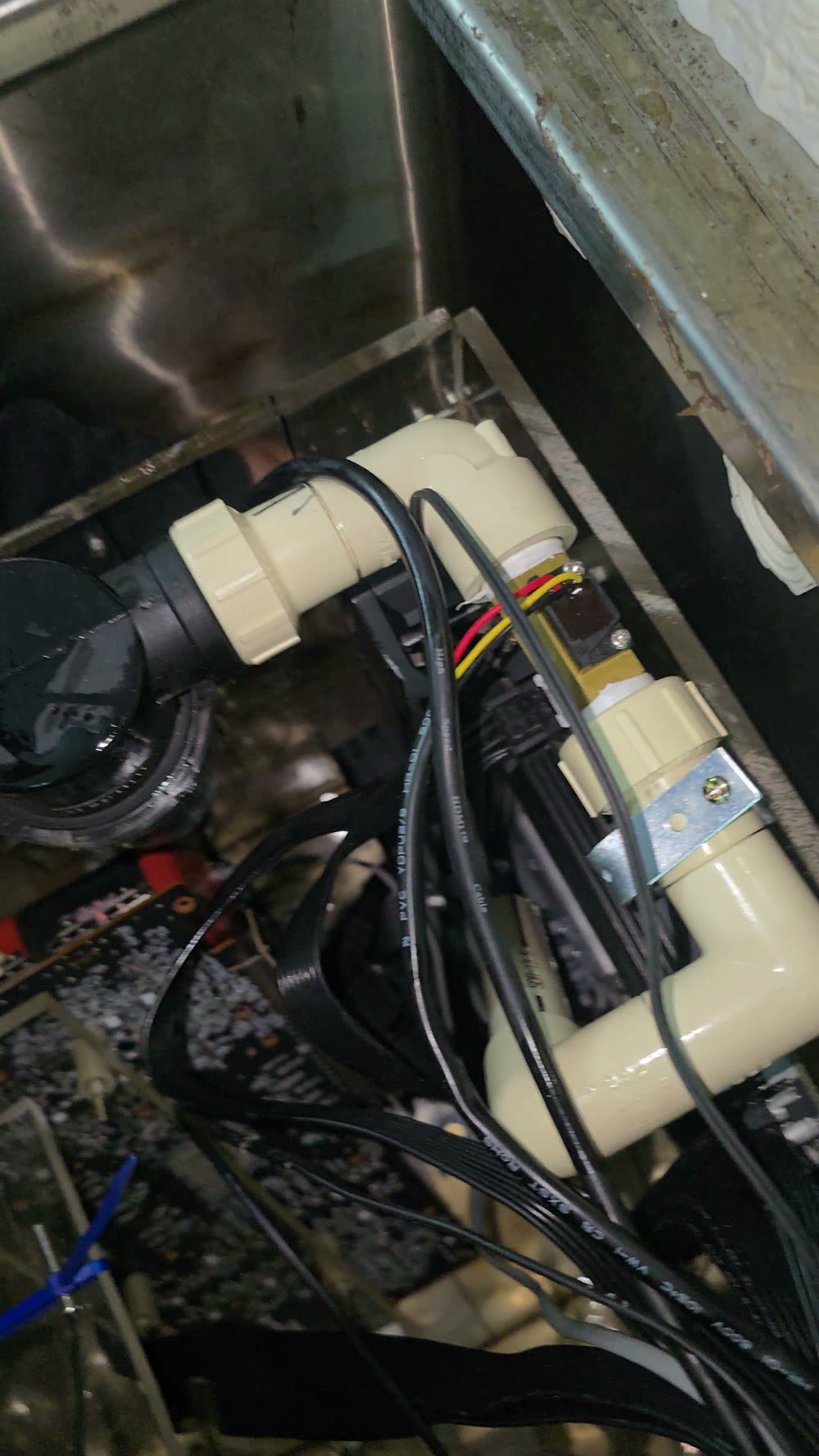 CoreVault immersion cooling loop — pump, flow sensor, plumbing